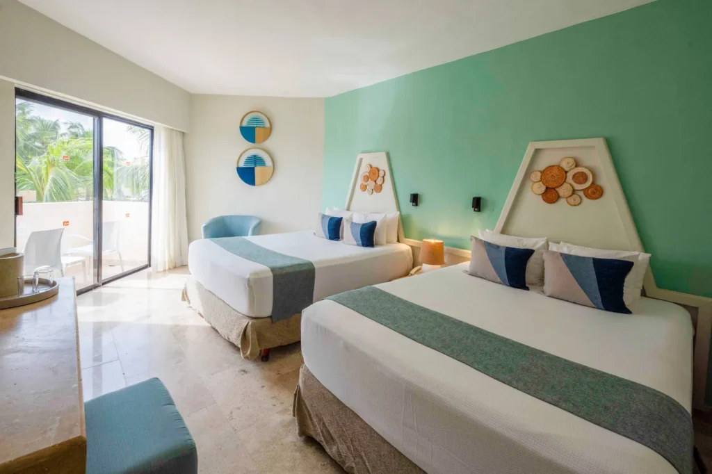 Habitación del Viva Maya by Wyndham con dos camas dobles